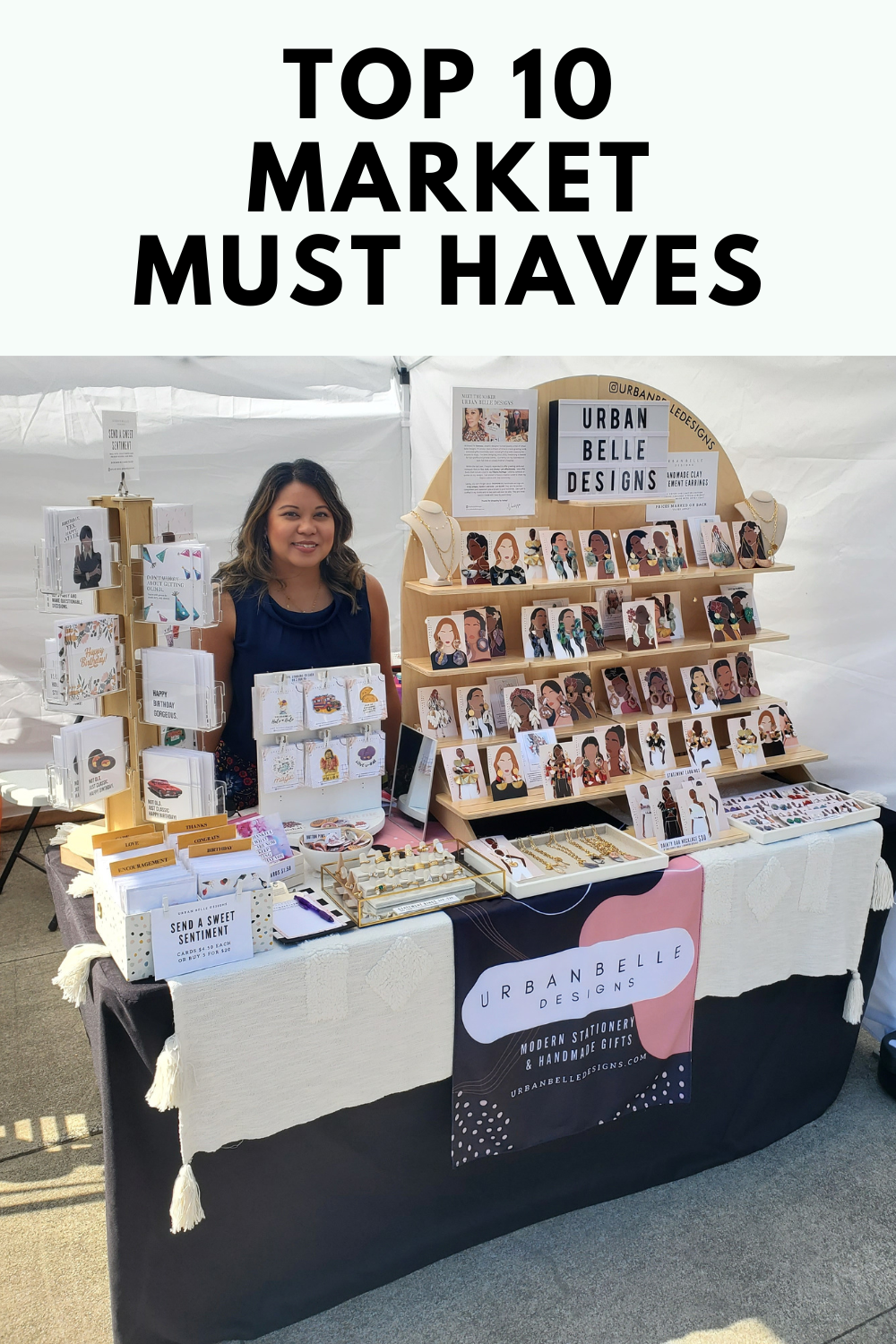 vendor market display set up using vertical display stands for jewelry and stationery